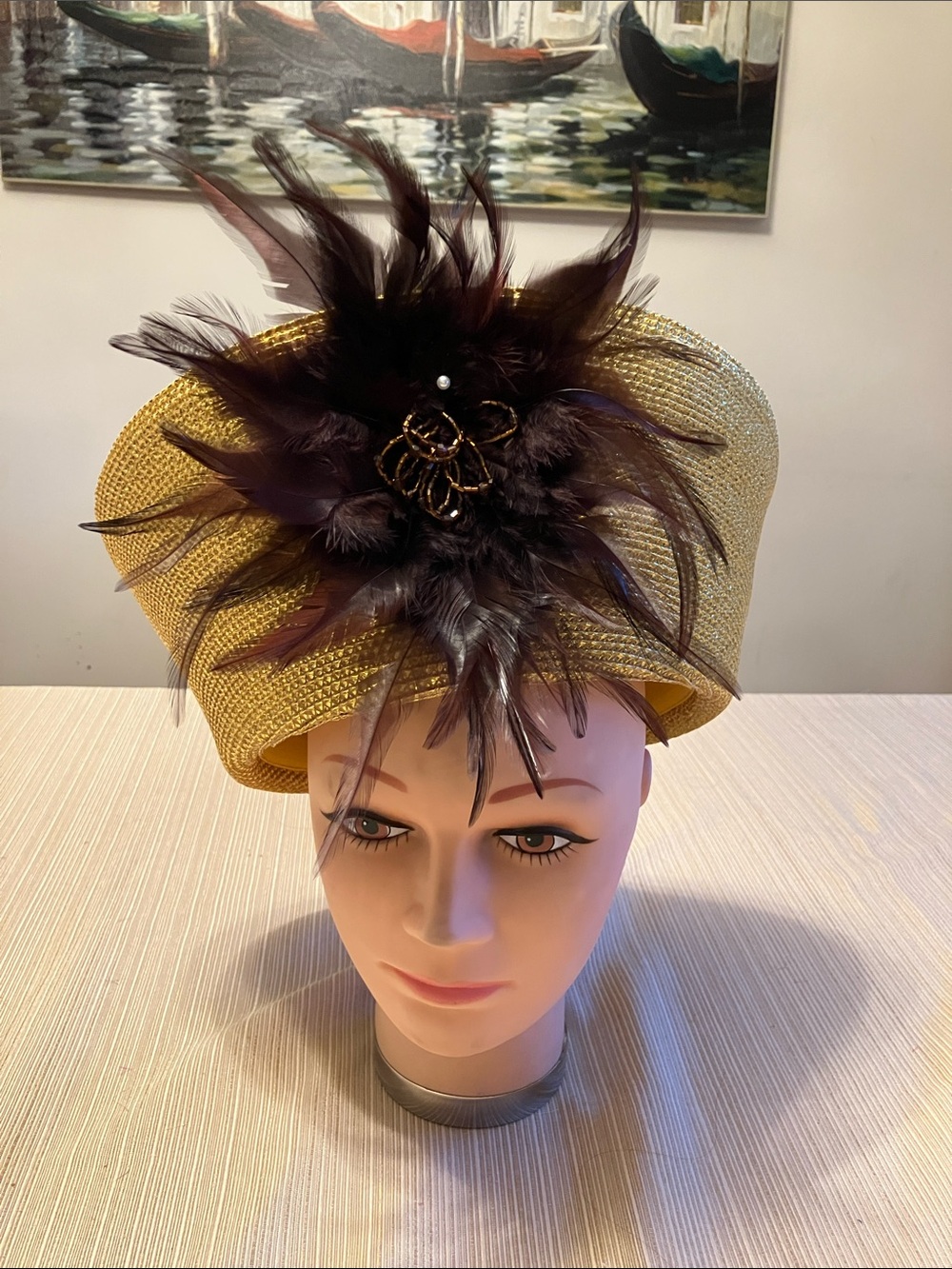 Chic Metallic Gold Hat with Brown Beaded Feather Bloom